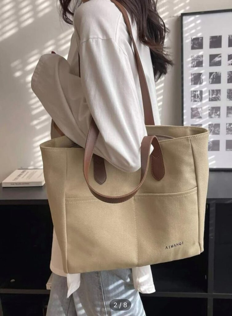 canvas tote bag, fabric handbag, cotton bag,with external pockets,natural beige color with brown leather strap, zipper top closure, daily essentials, for work,school, university,shopping, حقيبة قماش